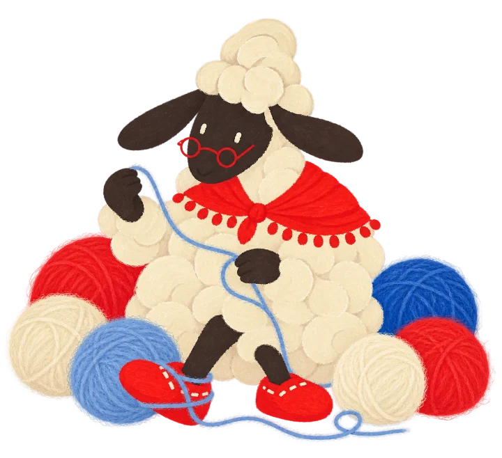 Purl sitting among balls of red, blue and cream yarn